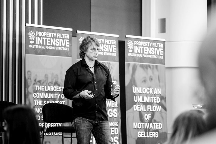 Speaker on stage at a Property Filter event