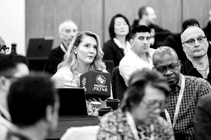 Delegates listening at a Property Filter event